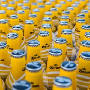 A close-up view of chilled Corona beer bottles displaying repetition and cool refreshment.